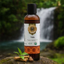 Bottle of 'Vata' organic ayurvedic oil with a natural background