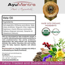 AyuMantra Vata Oil packaging with ingredients list, organic certification logos, and natural elements.