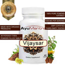 AyuMantra Vijaysar tablets bottle with herbal plant, root pieces and benefit text callouts.