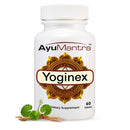 Ayumantra Yoginex tablets bottle on white background with gotu kola leaves and root, multi herb extract supplement.