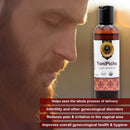Bottle of YoniPichu organic apaprecic oil with a man's face in the background