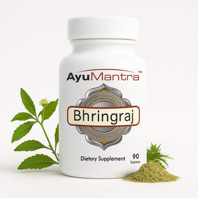 Ayumantra Bhringraj tablets bottle with fresh bhringraj leaves and herbal powder on white background.