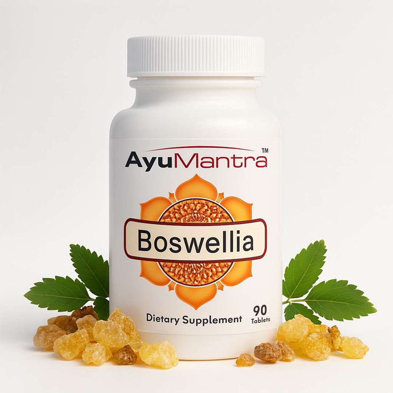 Ayumantra Boswellia tablets bottle with frankincense resin pieces and green leaves on a light background