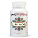 Closeup of Ayumantra Dashmool tablets bottle showing a colorful mandala label on a white container.