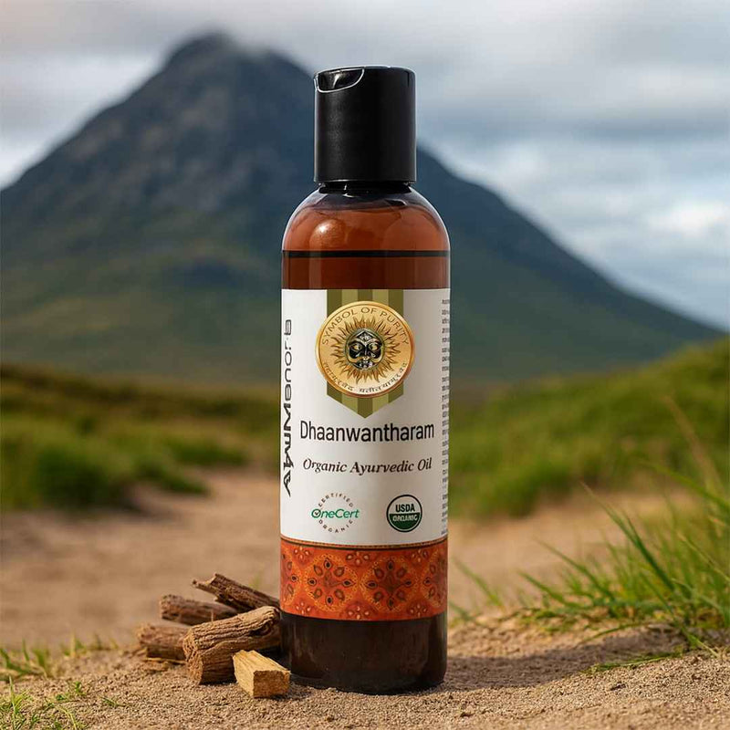 Bottle of Dhaawantharam Ayurvedic oil with mountains in the background