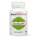 Front view of AyuMantra Guduchi tablets bottle with green herbal emblem on white background