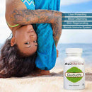 Woman stretching on beach beside AyuMantra Guduchi tablets bottle with wellness benefit captions