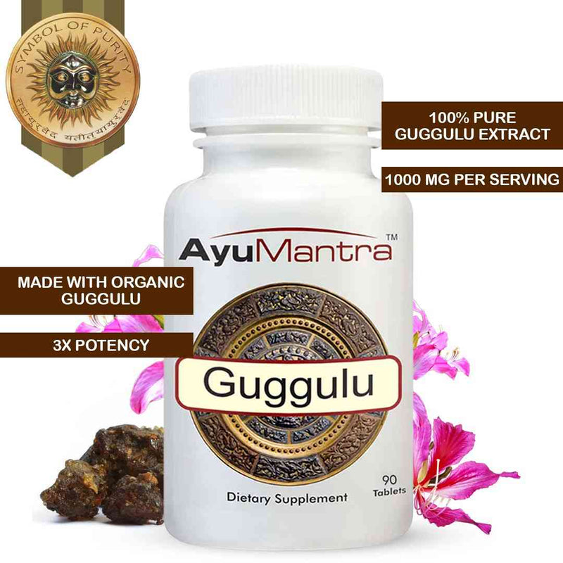 AyuMantra Guggulu tablets bottle with organic extract badge, guggul resin and flowers around the label.