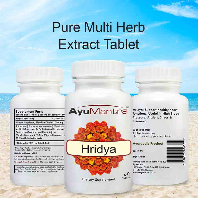 Front and back Ayumantra Hridya tablets bottles showing supplement facts over a beach backdrop