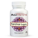 Front view of Ayumantra Kanchanara Guggulu tablets bottle showing lotus label and 90 tablets text.