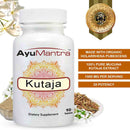 AyuMantra Kutaja tablet made with organic Holarrhena pubescent extract, shown with herb, flowers, and powder.