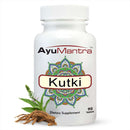 Ayumantra Kutki tablet bottle with fresh kutki leaves and roots on white background.
