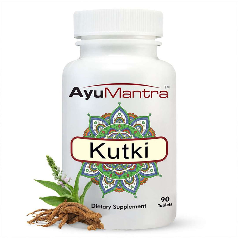 Ayumantra Kutki tablet bottle with fresh kutki leaves and roots on white background.
