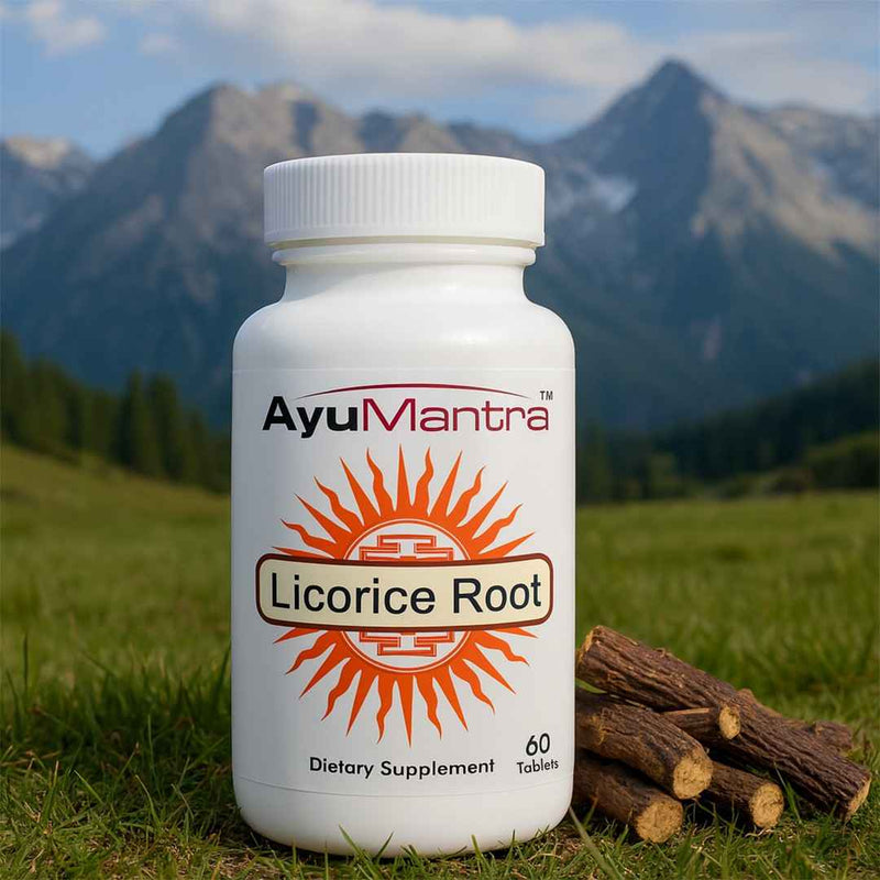 AyuMantra Licorice Root supplement bottle with licorice roots on grass with mountains in the background