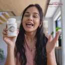 Taking a Bhringraj Tablet to rejuvenate hair from the root for thicker, shinier hair results.