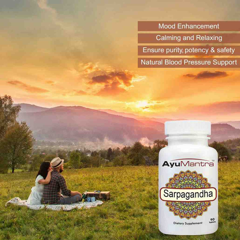 Ayurvedic supplement bottle labeled 'AyuMantra Sarpagandha' with a scenic background of a couple at sunset.
