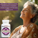 Woman with a bottle of AyuMantra Shankhpushpi supplement against a blurred natural background
